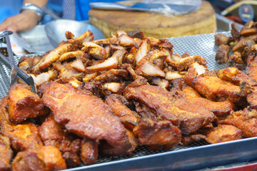 Close-Up of Crispy Deep-Fried Pork in Market Stall