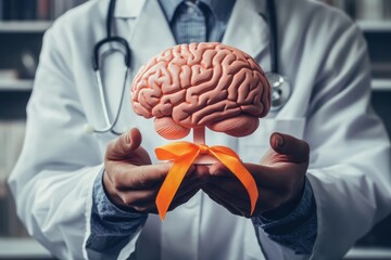 Doctor holding brain model with orange ribbon for brain health awareness