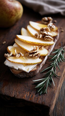 Bruschetta topped with sliced pears, walnuts, honey drizzle, garnished with rosemary sprig, resting on weathered wooden surface