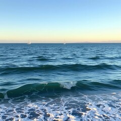 Obraz premium Peaceful ocean inlet with calm waves and distant sailboats, tranquility, idyllic, waterway