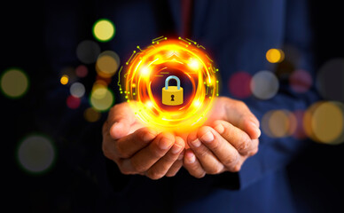 Businessman holding virtual yellow gold lock icon and internet network security technology....