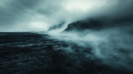 Obraz premium Black and white photo of a mountain landscape shrouded in fog and mystery