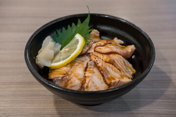 Grilled Salmon with rice, served in a bowl in the restaurant