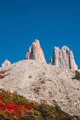 Cover page with magical colorful sunrise at major peaks, standing high towers, waterfall nearby...