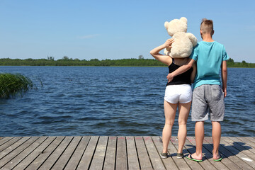 A Loving Couple Happily Enjoying a Beautiful Sunny Day Together by the Sparkling Water