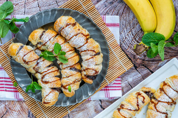 Bananas and chocolate spread baked in puff pastry