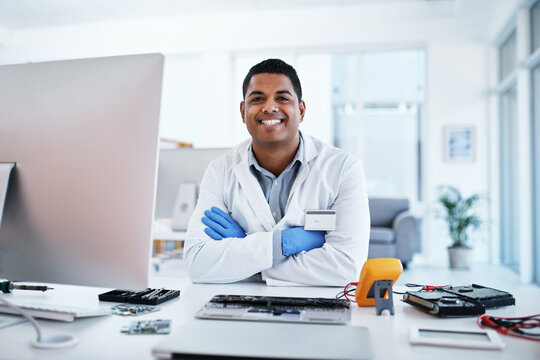 Man, portrait and computer engineer to repair in office, keyboard maintenance and upgrade system. Male person, arms crossed and installation of circuit chip, expert and technician for motherboard