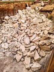 Container full of construction waste material after demolition
