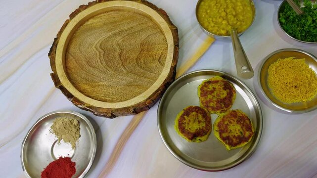 Empty plate is accompanied by different chutneys
