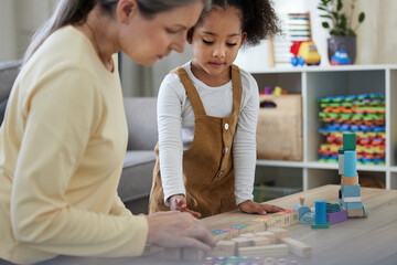 Therapist, child and development with toys for education, learning behavior and assessment for...