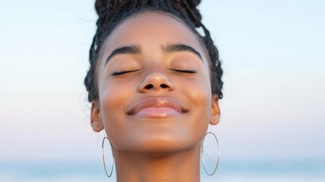 African female young joyful expression with braided hair outdoors