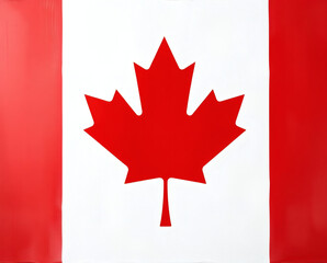 Fototapeta premium Canadian flag waving proudly against a clear blue sky, symbolizing national pride and heritage during a warm summer day