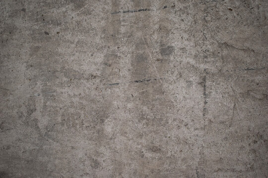 Imagen horizontal de un suelo sucio y desgastado color gris ideal para texturas