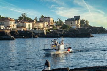 Traditional Fishing Boat Returning to the Picturesque Coast of Catania, Sicily