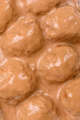 Meatballs with salt and spices in creamy caramel sauce