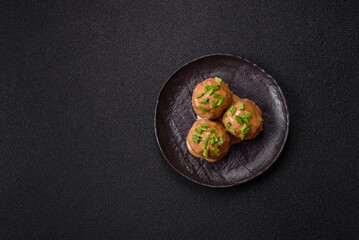 Meatballs with salt and spices in creamy caramel sauce