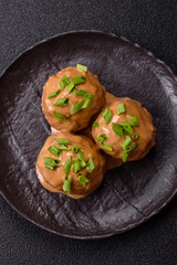 Meatballs with salt and spices in creamy caramel sauce