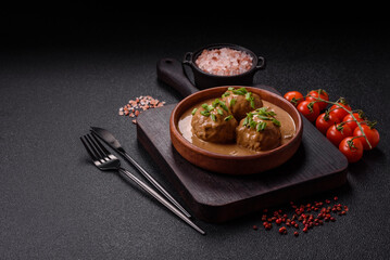 Meatballs with salt and spices in creamy caramel sauce
