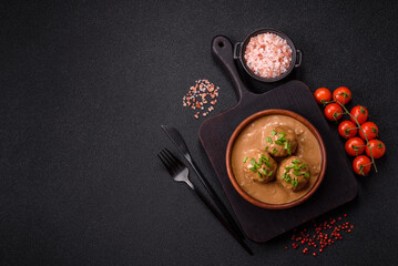Meatballs with salt and spices in creamy caramel sauce