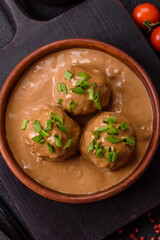 Meatballs with salt and spices in creamy caramel sauce