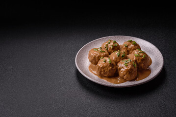 Meatballs with salt and spices in creamy caramel sauce