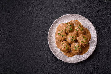 Meatballs with salt and spices in creamy caramel sauce