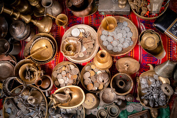 copper and bronze coins and handicrafts for sale in the city of la paz - handicrafts concept