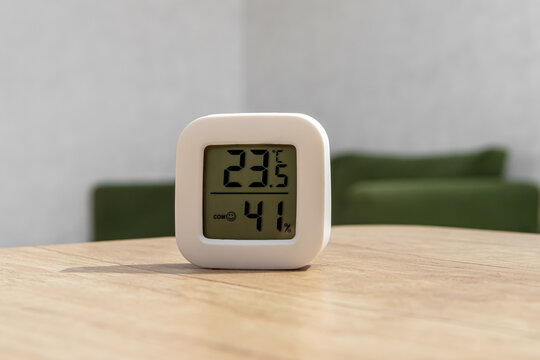 Small digital indoor temperature and humidity meter. Temperature sensor in living room. Temperature control