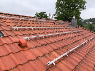 Red Tiled Roof with Aluminum Mounts for Future Solar Panel Installation