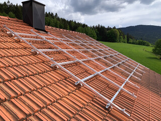 Red Tiled Roof with Aluminum Mounts for Future Solar Panel Installation