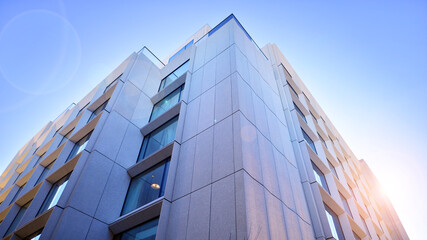 Fototapeta premium Large glass windows in a modern hotel building. Modern urban architecture. Large expanses of glass in concrete wall panels.