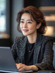 Mature Business Woman Working in Office for Marketing Campaigns