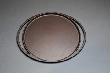 Black stone serving tray on blue background