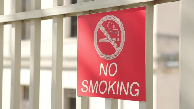 No Smoking sign posted on railing 4k
