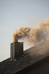 Thick white smoke from the chimney.