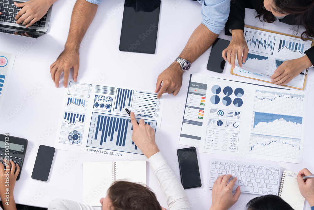 Leinwandbilder top view analyst team utilizing bi fintech to analyze financial data at table in meeting room. analy