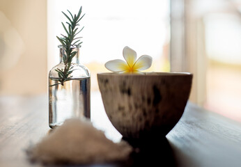 Flowers, rosemary and aesthetic in spa for beauty, wellness and self care treatment. Luxury salon, holistic and salt with herbs for cosmetics, aromatherapy and health detox for zen, calm and peace