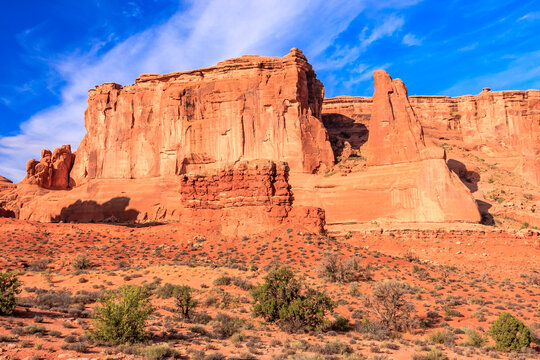 A rocky mountain range with a clear blue sky