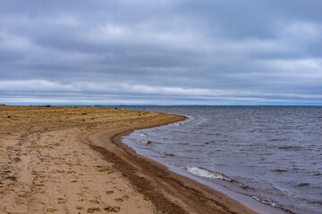 Sandy seashore against the sky