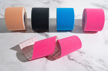 Elastic medical tapes of different colors used in physical therapy.