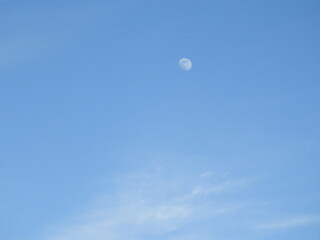A waxing gibbous moon, visible within a daytime sky, over Dorchester County, Maryland.