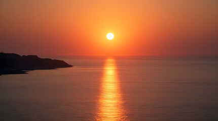 Stunning Sunset Over Calm Ocean Waters: Vibrant Orange Hues and Glowing Sun Reflection