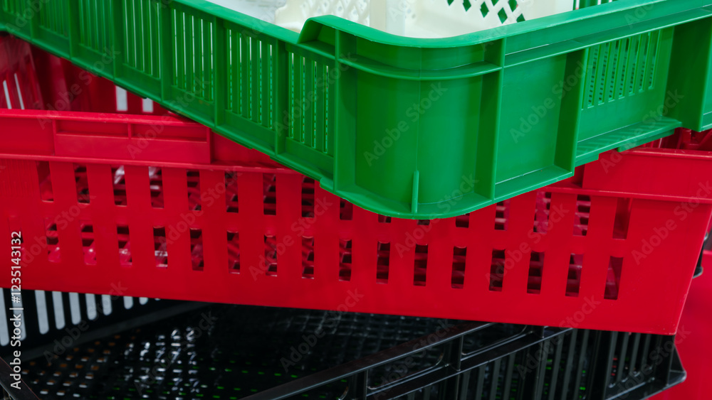 Poster a stack of plastic containers with different colors and sizes. concept of organization and variety, 