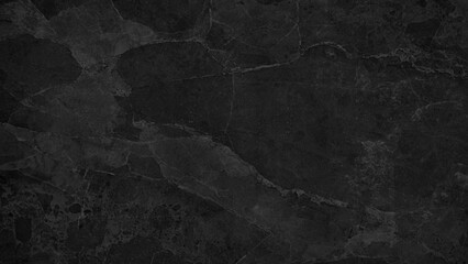 A black background with a greyish color. The background is made of stone and has a rough texture