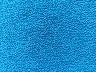 Surface blue microfiber plastic carpet mat texture. blue seamless carpet texture shot from above texture background