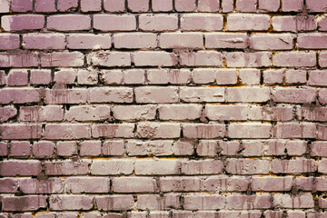 A brick wall with a fire hydrant in front of it, great for cityscape or construction background.
