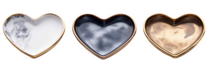 Trio of decorative heart-shaped trays: marble, black, and metallic gold designs png