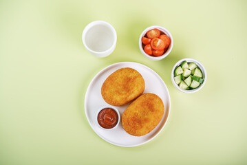 Asian potato cakes with filling, croquet, korokke with tomato sauce in a plate