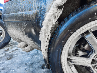 Icicles Are Forming under a Car wheel arch Harsh Winter Conditions and Cold Environments