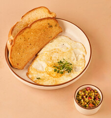 bread and omelette in white plate for restaurant menu